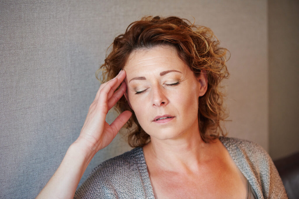 close-up-portrait-middle-aged-woman-with-hand-head-pain